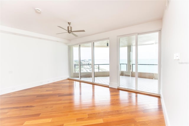 unfurnished room featuring ceiling fan and light hardwood / wood-style floors