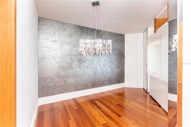 unfurnished dining area with hardwood / wood-style floors