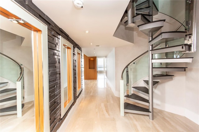 stairs featuring hardwood / wood-style flooring