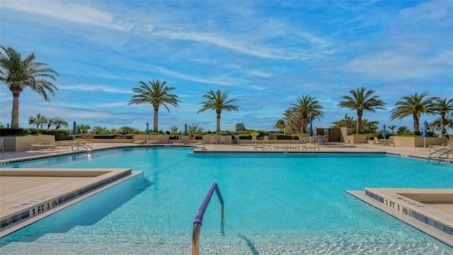 view of swimming pool with a patio area