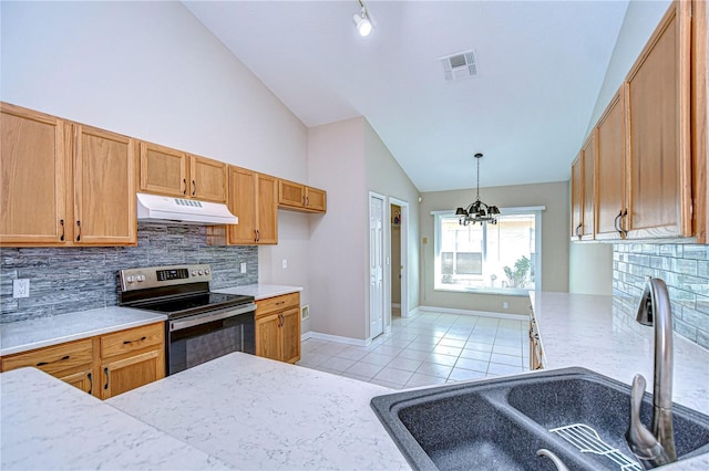 kitchen with backsplash, stainless steel electric stove, sink, light tile patterned floors, and a chandelier