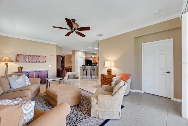 living room with ceiling fan, light tile patterned floors, and crown molding