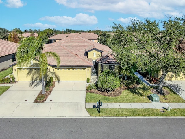 mediterranean / spanish-style home with a garage