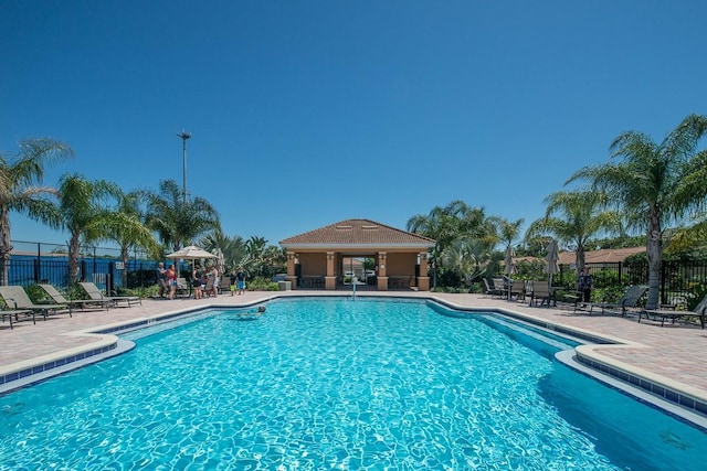 view of swimming pool with a patio area