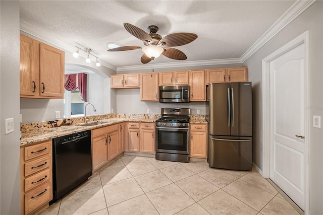 kitchen featuring appliances with stainless steel finishes, a textured ceiling, crown molding, and sink