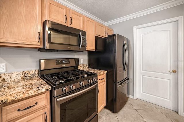 kitchen featuring crown molding, light tile patterned floors, a textured ceiling, appliances with stainless steel finishes, and light stone counters