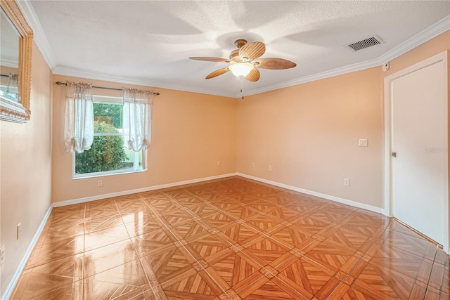 empty room with ceiling fan, parquet flooring, a textured ceiling, and ornamental molding