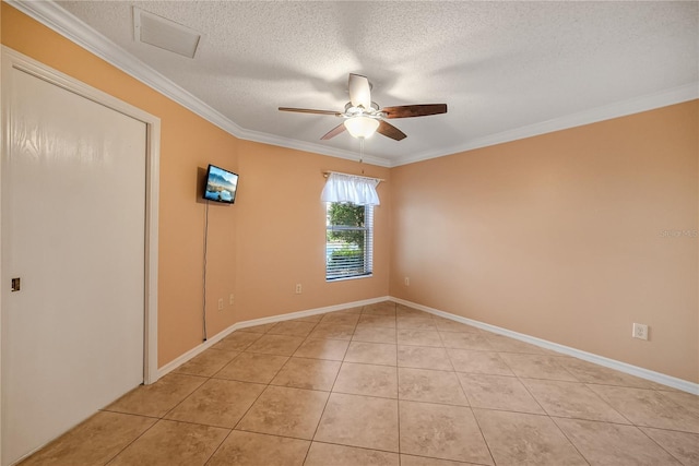 tiled empty room featuring crown molding, ceiling fan, and a textured ceiling