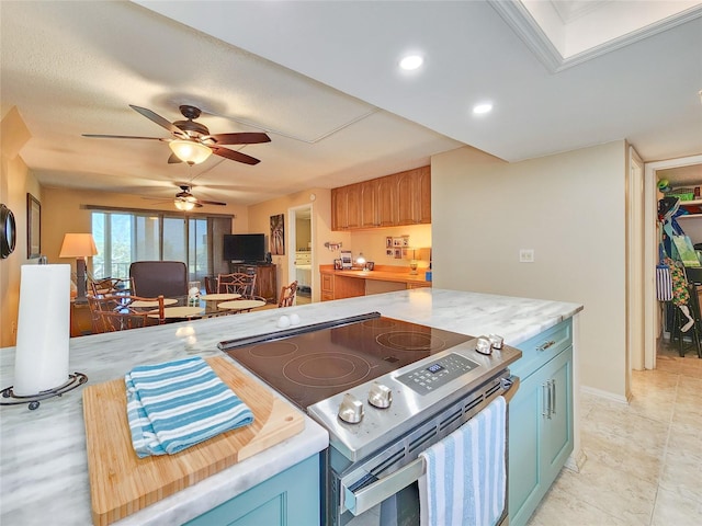 kitchen featuring stainless steel electric stove, butcher block countertops, and ceiling fan