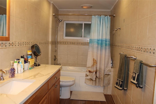 full bathroom with shower / bath combo, vanity, toilet, and tile walls