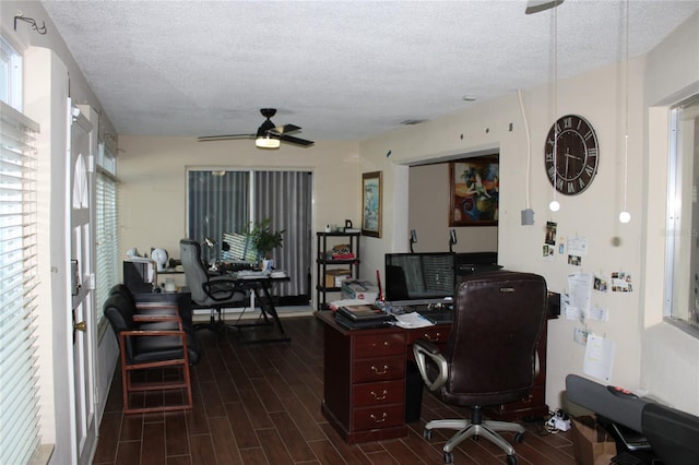 office area featuring ceiling fan, dark hardwood / wood-style flooring, and a textured ceiling