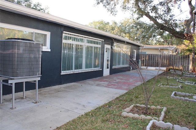 back of property with a patio