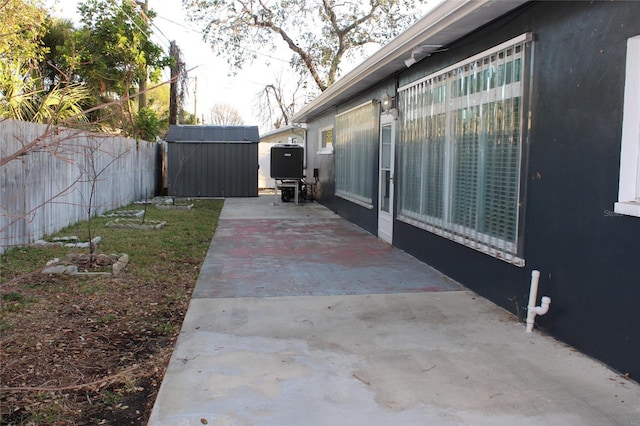 view of patio with a shed