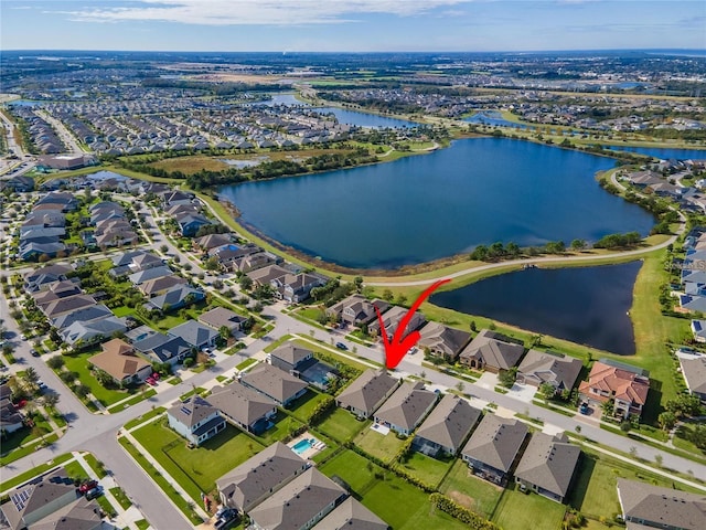 birds eye view of property with a water view