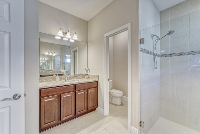 bathroom featuring walk in shower, tile patterned floors, vanity, and toilet