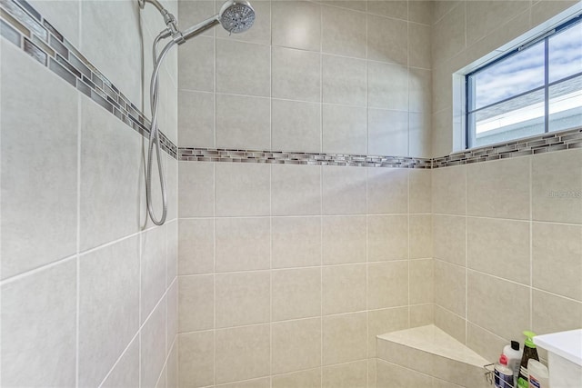 bathroom with tiled shower