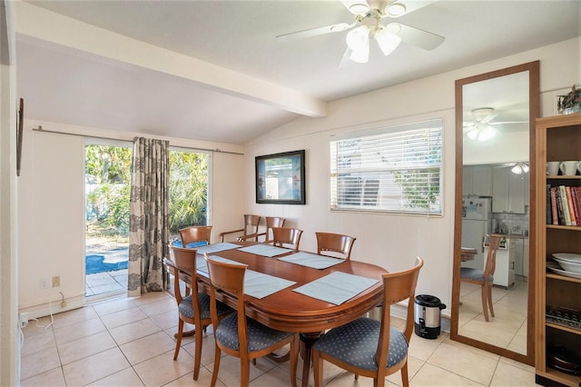 dining area with plenty of natural light, lofted ceiling with beams, ceiling fan, and light tile patterned flooring