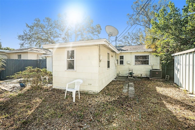 back of property with central AC unit