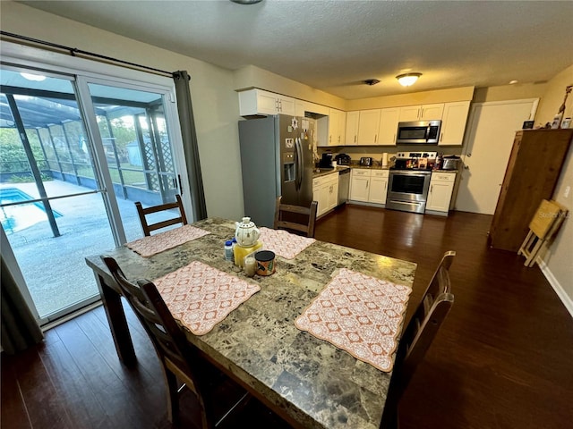 dining area with dark wood-type flooring