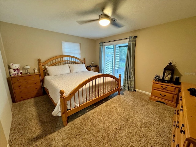 bedroom featuring ceiling fan and dark colored carpet