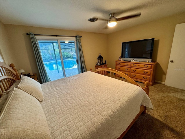 carpeted bedroom featuring access to exterior, ceiling fan, and a textured ceiling