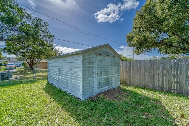 view of outbuilding with a lawn