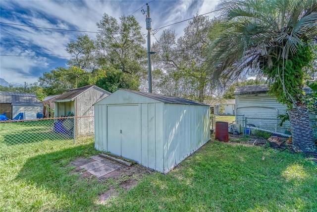 view of outbuilding featuring a lawn