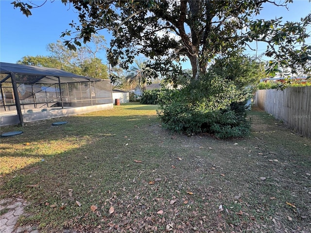 view of yard featuring a lanai