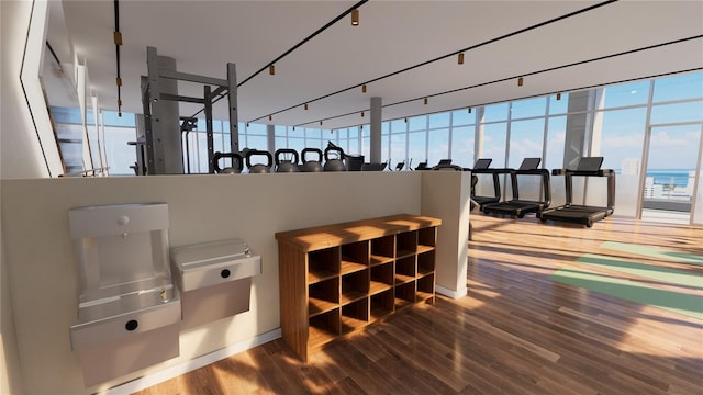 interior space with hardwood / wood-style floors and a water view