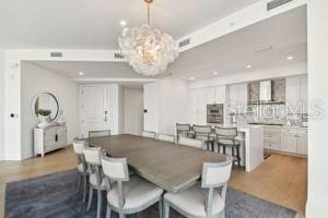 dining area featuring an inviting chandelier and light hardwood / wood-style flooring