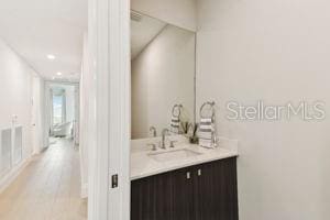 bathroom featuring hardwood / wood-style floors and vanity