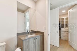 bathroom with vanity and toilet