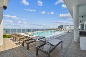 view of pool featuring a water view