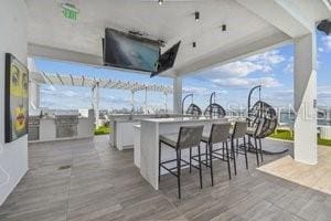 view of patio featuring exterior bar