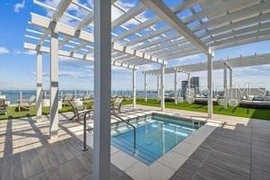 view of pool featuring a jacuzzi