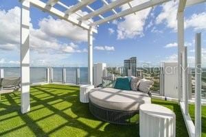 exterior space with a pergola and a water view