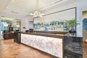 reception area featuring a chandelier