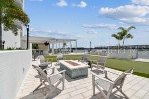 view of patio featuring a fire pit