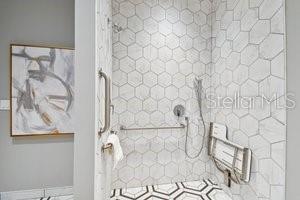 bathroom with a tile shower