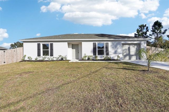 single story home featuring a front lawn and a garage