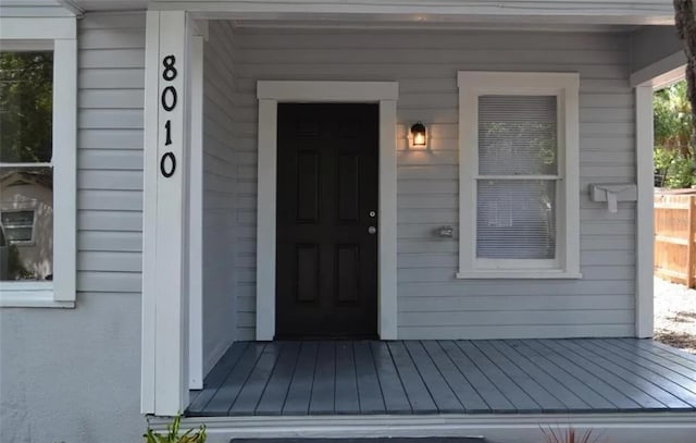 entrance to property featuring covered porch