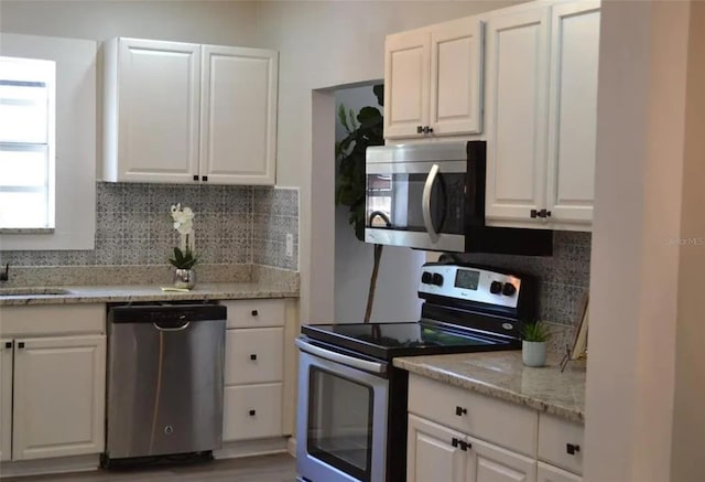 kitchen with white cabinetry and stainless steel appliances