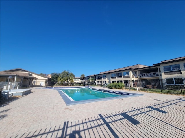 view of swimming pool with a patio