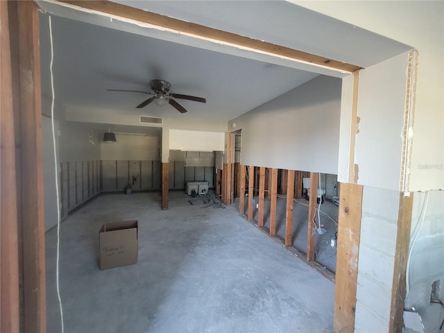 interior space with concrete floors and ceiling fan