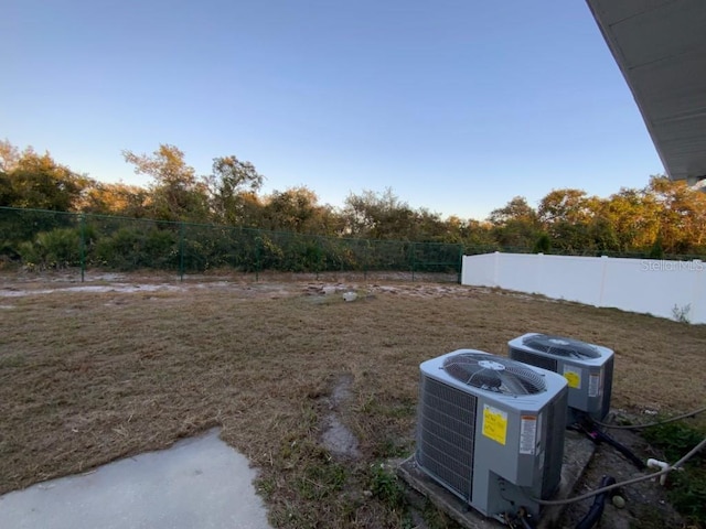 view of yard featuring central AC unit