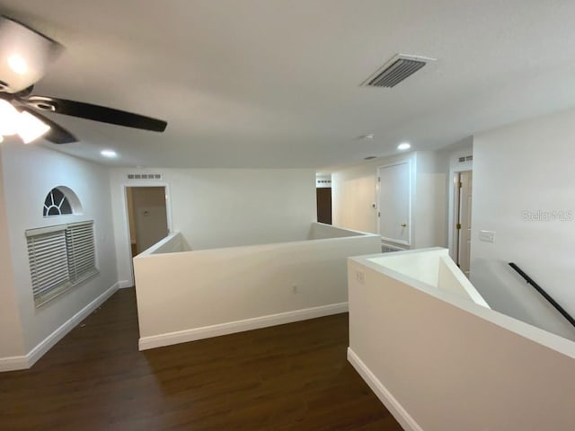 hallway featuring dark wood-type flooring