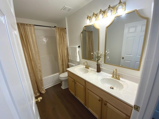 full bathroom featuring toilet, vanity, shower / tub combo, and hardwood / wood-style flooring