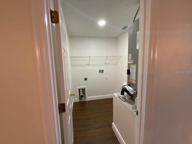 clothes washing area with electric dryer hookup, washer hookup, and dark hardwood / wood-style flooring