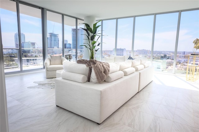 living room featuring a wall of windows