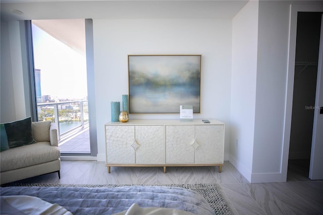 living room with a water view and plenty of natural light